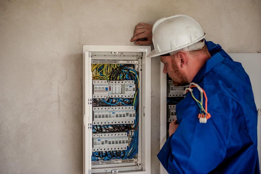 Electrician checking voltage